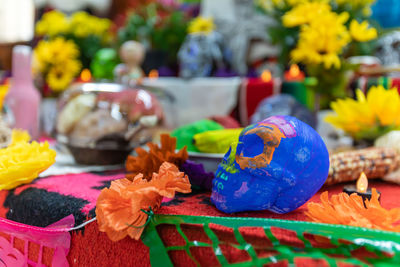 Close-up of multi colored flowers on table