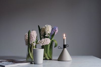 Close-up of flower vase on table at home