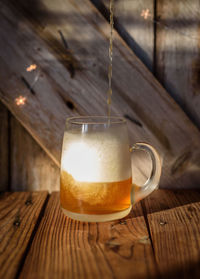 Close-up of beer glass on table