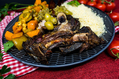 Close-up of food in plate against black background