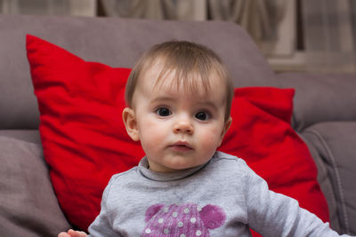 Portrait of cute baby girl at home