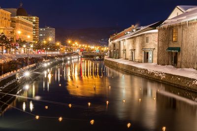 Illuminated buildings in city at night