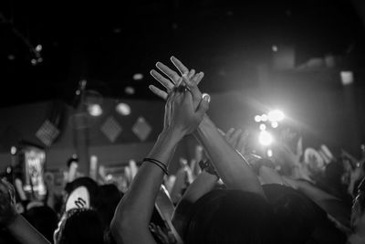 People clapping during event at night