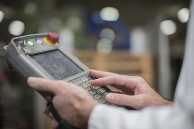 Worker using control panel