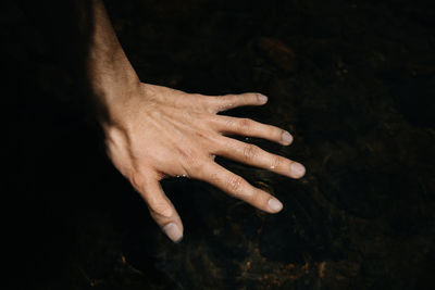 High angle view of hand against blurred background