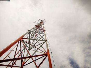 Low angle view of communications tower against sky