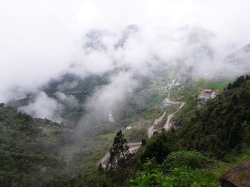 Scenic view of fog against sky