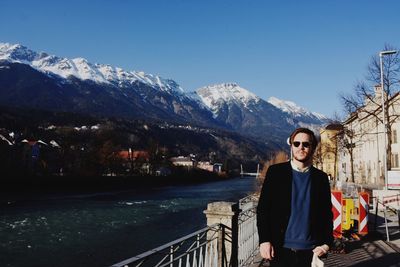 Portrait of woman standing on mountain
