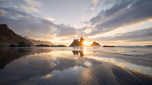 Scenic view of benijo beach against sky at beautiful sunset. tenerife, canary islands, spain.