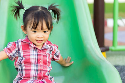 Cute girl playing in playground