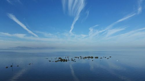 Scenic reflection of clouds in calm sea