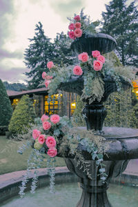 View of statue by trees against sky