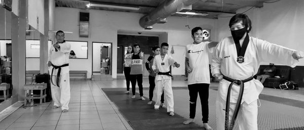 People standing in corridor of building