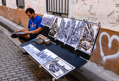 High angle view of man using mobile phone in city