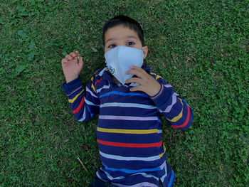 Portrait of boy wearing hat on field