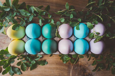 High angle view of multi colored eggs on table