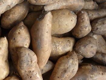 Full frame shot of sweet potato for sale at market stall