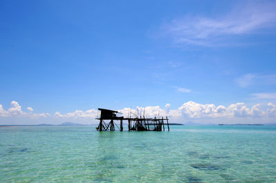 Scenic view of sea against blue sky