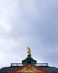 Low angle view of statue against sky