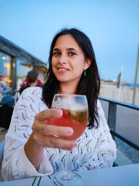 Portrait of woman with a glass of sangria