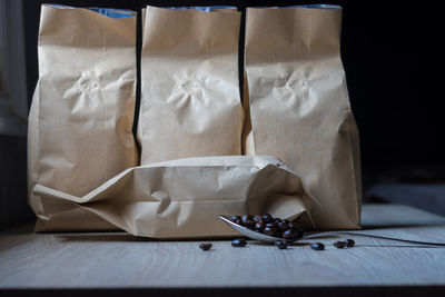 Close-up of paper bags on table