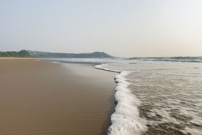 Scenic view of beach against clear sky