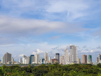 Panoramic shot of modern buildings against sky