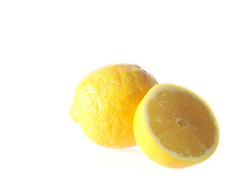 Close-up of fruit over white background