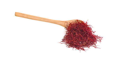 Close-up of red chili pepper against white background