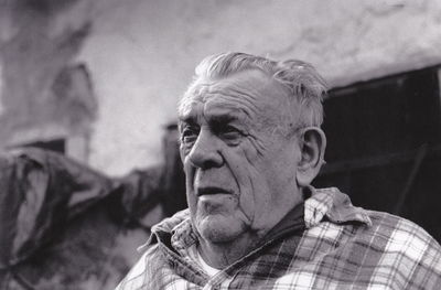 Close-up of man looking away outdoors