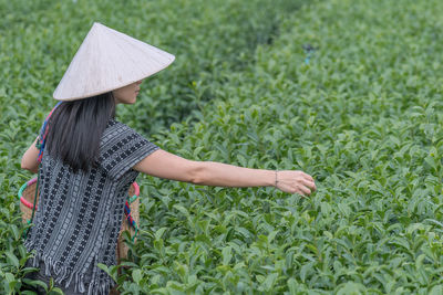 Rear view of girl on field