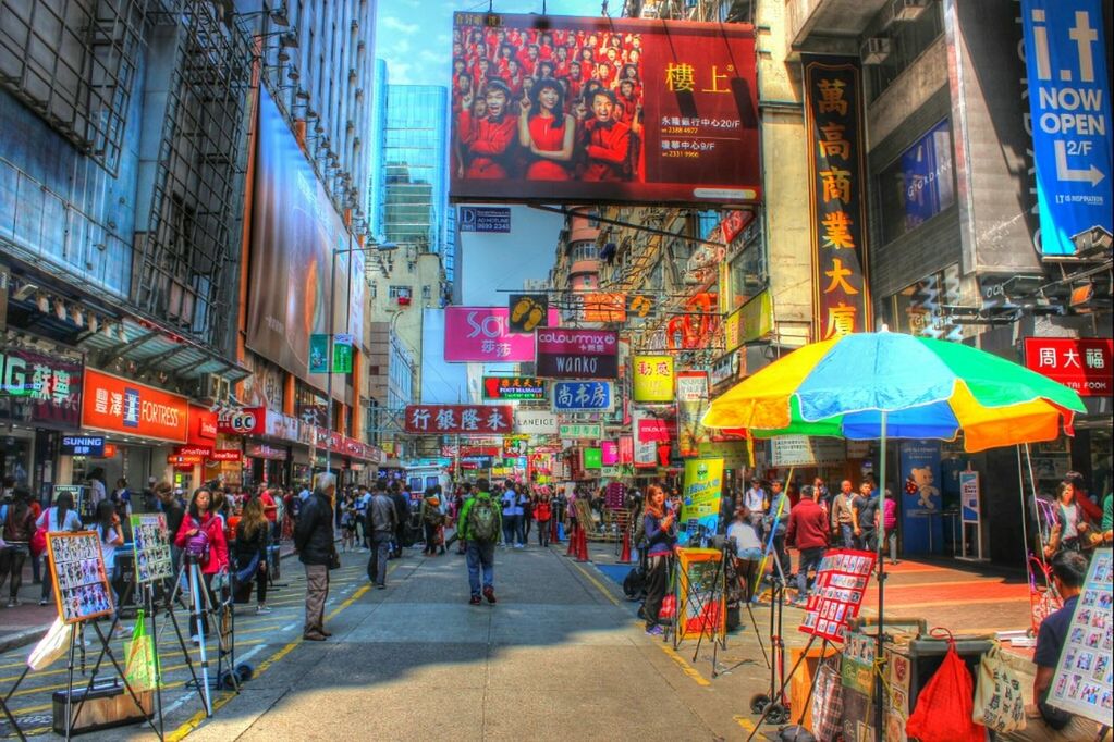 street, city, large group of people, building exterior, architecture, built structure, person, market, city life, men, text, store, retail, market stall, walking, lifestyles, non-western script, shopping, multi colored