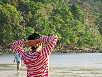 Rear view of man on beach