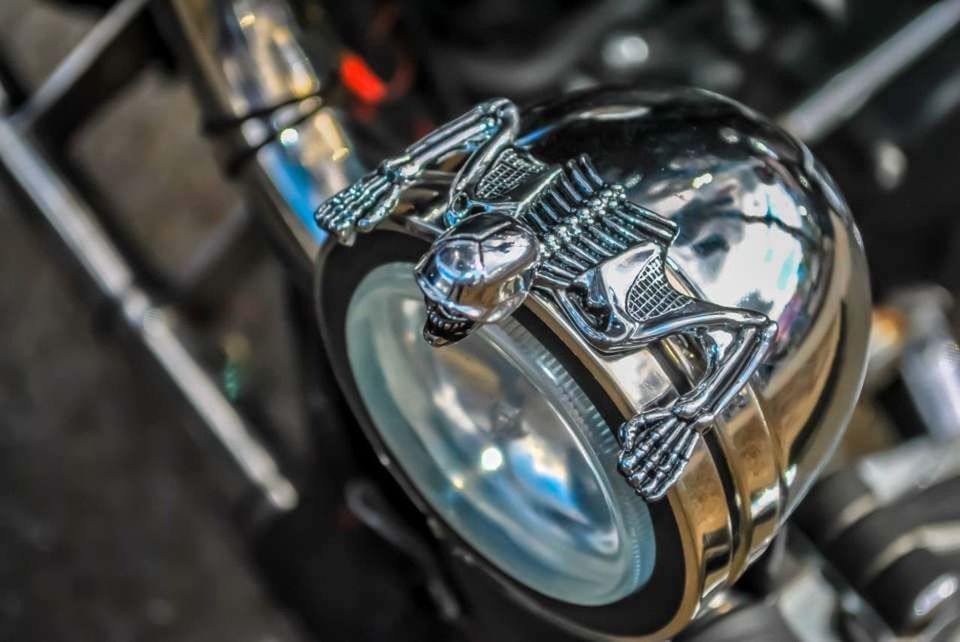 close-up, metal, focus on foreground, mode of transportation, no people, land vehicle, motorcycle, shiny, transportation, car, selective focus, silver colored, day, indoors, motor vehicle, headlight, luxury, reflection, wealth, high angle view, chrome
