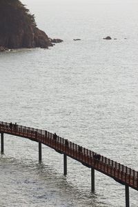 Pier over sea against sky