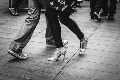 Low section of people dancing on floor