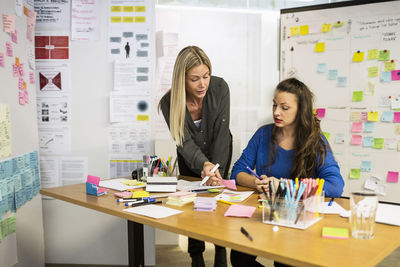 Businesswomen working together in creative office