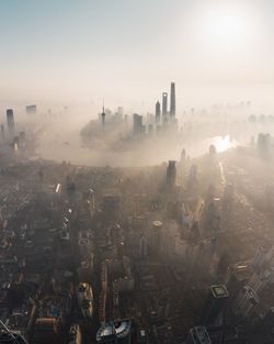 High angle view of city buildings against sky