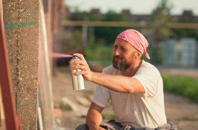 Young man drinking beer glass