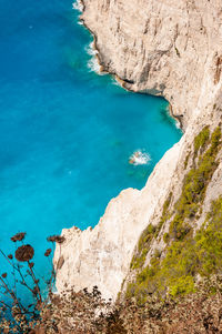 High angle view of rocks by sea