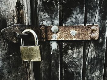 Close-up of padlocks on metal