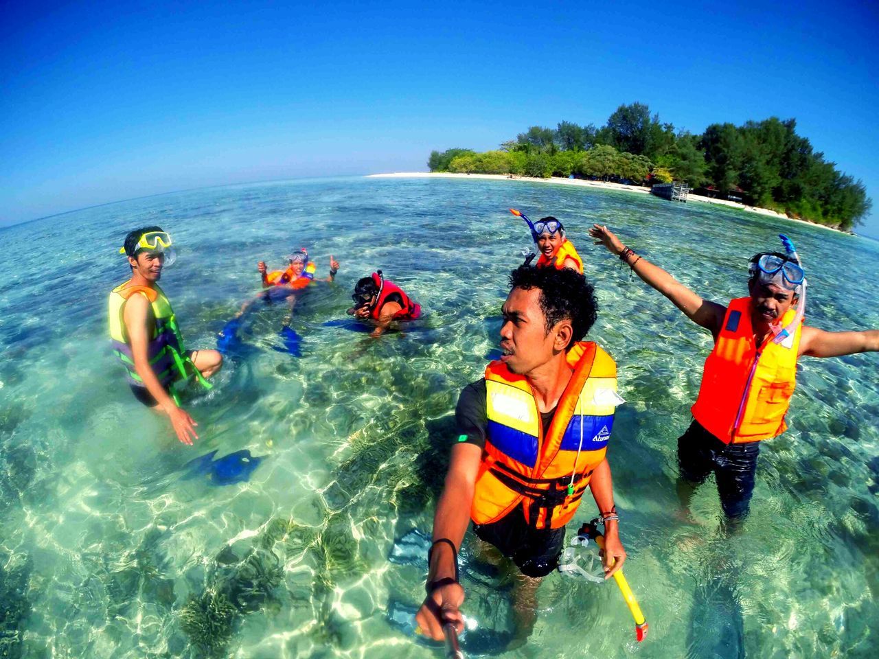 water, leisure activity, lifestyles, enjoyment, vacations, fun, blue, togetherness, sea, waterfront, men, boys, shirtless, clear sky, childhood, adventure, swimming, weekend activities