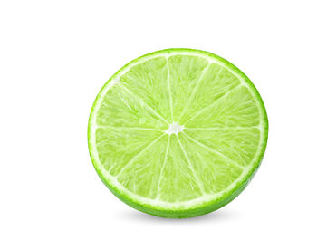 Close-up of lemon slice against white background