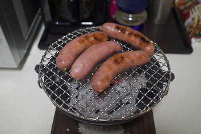 High angle view of meat on barbecue grill