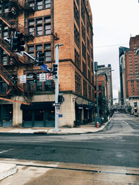 View of street in city against clear sky