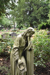 Close-up of statue in cemetery