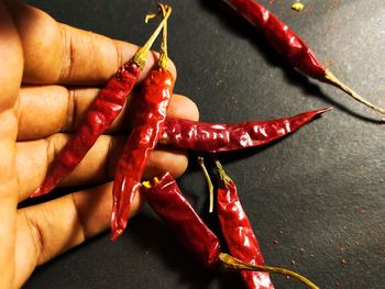 Close-up of red chili peppers on table