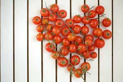 Directly above shot of heart shape made from cherry tomatoes