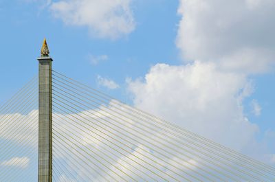 Low angle view of tower against blue sky
