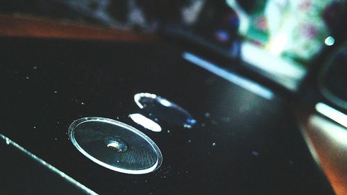 High angle view of bubbles on wet table